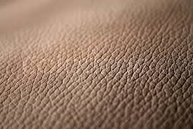 how to tell genuine leather from faux leather 